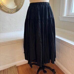 Black drop waist cotton skirt by Manuelle Guibal